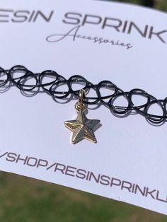 One size fits all black elastic tattoo choker necklace with a dainty nickel-free gold enamel star charm ✨ Star is approximately 1cm x 1cm  Thanks for visiting my shop! ⭐️ Adjustable Trendy Star Charm Necklace, Trendy Adjustable Star Charm Necklace, Trendy Star Charm Choker As Gift, Adjustable Star Shaped Choker As A Gift, Trendy Choker With Star Charm For Gift, Adjustable Star Shaped Choker For Gift, Trendy Choker Necklace With Star Charm, Star Charm Choker Necklace For Gifts, Black Star Charm Jewelry