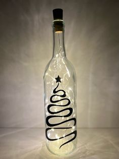 a bottle that has some lights in it and the word boooo written on it