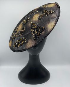 Gorgeous Black and gold animal print with singularly placed black and gold diamantés Fascinator sparkly sinamay with acrylic's Bespoke Headpieces for all your occasions, made to order, please email me at... enquiries@fascinators-by-d.com for further info...  Material colour swatches can be sent 1st class Royal Mail prior to ordering any design displayed (free of charge) Please request if this is something you feel the need to require before purchase. We cannot guarantee that the display design w Luxury Adjustable Headpieces For Parties, Gold Adjustable Fascinator With Structured Crown, Gold Hat With Structured Crown For Party, Gold Hat With Structured Crown For Evening, Gold Structured Crown Hat For Evening, Embellished Adjustable Headpieces For Evening, Gold Mini Hats With Structured Crown For Evening, Gold Headpiece For Evening At Royal Ascot, Adjustable Gold Headpieces For Evening