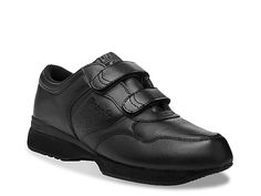 a pair of black shoes with velcro straps