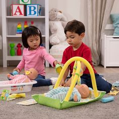 two children playing with toys on the floor