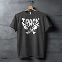 Show off your love for track and field with this stylish and comfortable Running Tee TNF XC. This Run Track and Field Shirt is perfect for runners of all levels. Running Tee TNF XC This modern track and field t-shirt features a bold design of winged running shoes with "TRACK" emblazoned above. Made with premium Airlume cotton, this super-soft unisex tee is available in a variety of heather colors. The classic fit is flattering on everyone, and the side seams provide a contoured look. Run Track a Track Shoes, Black Running Shoes, Bold Design, Track And Field, Running Shoes, Track, Running, T Shirt, Design