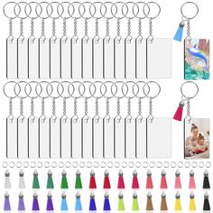 a set of six key chains with different color tassels on each one side