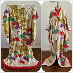 "For your consideration Heavily embroidered colorful vintage wedding kimono with vibrant red lining. Tag on inner sleeve. Multicolor butterfly/moth design with flower carts. Lots of gold threading. Quilted bottom hem. Pre owned, shows general wear. Overall good used condition. Presents beautifully, but does have flaws - sold AS IS. There is discoloration/yellowing, pinholes and surface wear/snaggy bits in areas throughout. Some hanger creases from storage/display. The discoloration is mainly nea Traditional White Kimono With Floral Embroidery, Wedding Kimono With Floral Embroidery, Traditional Embroidered Kimono For Tea Ceremony, Traditional White Kimono For Ceremonies, Long Floral Embroidered Kimono For Wedding, Traditional Wedding Kimono With Floral Embroidery, Vintage Red Kimono For Wedding, Vintage Long Kimono For Wedding, Vintage Wedding Kimono With Kimono Sleeves