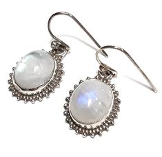 Moonstone earrings 925 Sterling silver earrings Moonstone gemstone dangles Rainbow moonstone dangle earrings Genuine moonstone dangle and drop earrings Natural moonstone jewelry Sterling silver jewelry Authentic moonstone jewelry June birthstone earrings Birthday gift Bridal earrings Wedding jewelry Contemporary jewelry Every day earrings Dimensions: 2.8 x 1.8 cm  Moonstone gemstones 1.1 x 0.9 cm White Moonstone Earrings, White Moonstone Drop Earrings, White Moonstone Dangle Earrings, White Oval Moonstone Earrings, Moonstone Earrings, Moonstone Jewelry, Birthstone Earring, Pretty Earrings, June Birth Stone