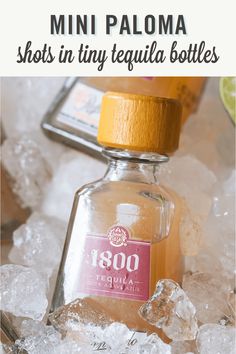 a bottle of tequila sitting on top of ice