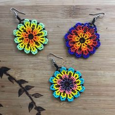 Add a pop of color to your outfit with these colorful earrings! Our beautiful flower earrings were handmade in Chiapas, Mexico by our artisans. Bring a hint of this beautiful culture with you anywhere you go. Drop length: 2 in Width: 1.5 in *Measurements are approximate. Bohemian Flower Drop Earrings For Festivals, Adjustable Drop Flower Earrings For Festival, Bohemian Fair Trade Adjustable Beaded Earrings, Bohemian Summer Flower Earrings With Ear Wire, Dangle Flower Earrings With Ear Wire For Festival, Handmade Bohemian Flower Earrings, Handmade Bohemian Drop Flower Earrings, Bohemian Adjustable Flower Earrings With Colorful Beads, Bohemian Flower Earrings With Colorful Beads For Festivals