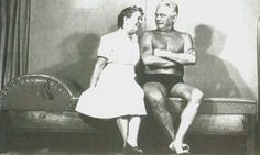 an old black and white photo of two people