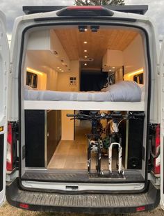 the back end of a van with bikes in it