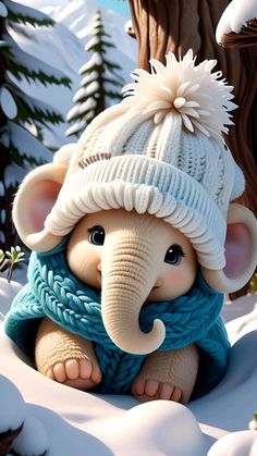 an elephant wearing a hat and scarf in the snow