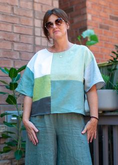 Oversized boxy fit top is crafted from 100% linen in one of a kind patchwork in a combination of sage, lime and grey hues. The loose fit of this top offers versatility, allowing you to effortlessly layer it for year-round wear. Whether you dress it up or down, this top exudes casual elegance and will keep you cool on hot summer days. -One of a kind linen patchwork adds a unique and artistic flair to each piece -Lightweight and breathable linen fabric for cool and comfortable wear -Oversized boxy fit -Ideal for layering and suitable for year-round wear Cut and sewn in Toronto. Summer Linen Patchwork Tops, Linen Patchwork, Boxy Blouse, Patchwork Clothes, Quilted Clothes, Japanese Embroidery, Boho Tunics, Womens Blouses, Linen Top