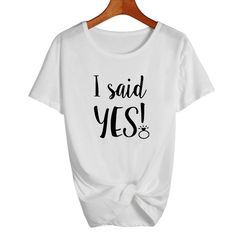 a white t - shirt that says i said yes on the front, and an image of