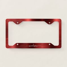 a red metal license plate with the word madison on it's front and side