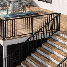 a deck with chairs and table on it next to the stairs that lead up to an outdoor dining area