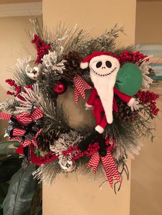 a christmas wreath with a skeleton on it