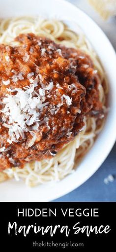 a white bowl filled with spaghetti and sauce