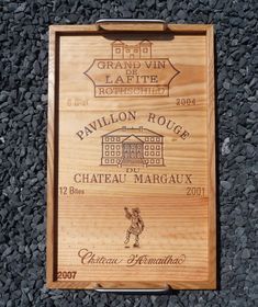 a plaque on the side of a building that reads grand vin lafite, pavillon rouge chateau margaux