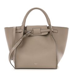 This is an authentic CELINE Supple Grained Calfskin Small Big Bag in Light Taupe. This chic structured tote is crafted of finely grained calfskin leather in beige. This shoulder bag features tall rolled leather top handles, a leather shoulder strap and silver hardware. The top opens to a suede interior with a hanging zipper pocket. Elegant Taupe Shoulder Bag With Metal Hardware, Elegant Taupe Shoulder Bag With Palladium Hardware, Business Bags In Taupe With Palladium Hardware, Taupe Business Bags With Palladium Hardware, Cream Calf Leather Bags With Palladium Hardware, Formal Taupe Bag With Silver-tone Hardware, Luxury Beige Pebbled Leather Shoulder Bag, Beige Calf Leather Satchel With Handle Drop, Luxury Taupe Calf Leather Shoulder Bag