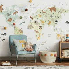 a child's room with a world map on the wall and stuffed animals around it