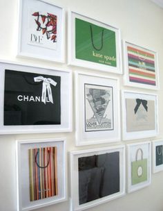 there are many pictures on the wall with bags hanging from it's sides,