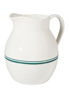 a white pitcher with green lines on the bottom and side line in the middle, against a white background