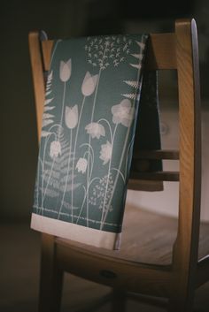 a chair with a green and white floral design on it