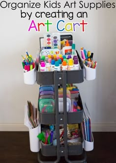 a cart filled with art supplies on top of a wooden floor