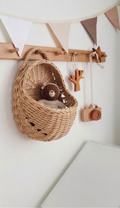 a wicker basket hanging on the wall