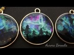 three pendants that have been made to look like the aurora borens in space