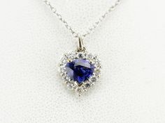 We've set this classic pendant with a deep blue sapphire of excellent quality. The setting is filled with bright white diamonds, reflecting brilliance and life into this gorgeous gemstone. This pendant does not come with the chain shown. Please feel free to contact us, we will help you find the perfect chain for your style and budget! Metal: 18K White Gold Gem: Sapphire 1.03 Carats Gem Measurements: 5.7 x 7.1 mm, Pear Cut Accents: 12 Diamonds totaling .36 Carats, G in Color, VS in Clarity Measurements: 11 x 16 mm, with bail Marks: "18K" Stamped on the reverse Princess Cut Earrings, Jewelry Layering, Gift For Anniversary, Halo Pendant, Diamond Bangle, Tennis Bracelet Diamond, Diamond Halo, Sapphire Diamond, White Diamonds