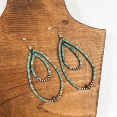 These gorgeous earrings are genuine Native American artwork. They include a long turquoise beaded teardrop with sterling silver Navajo pearls.Earrings measure approximately 3.5 inches long. SKU: #1103-2229 Bohemian Sterling Silver Teardrop Beaded Earrings, Handmade Southwestern Turquoise Teardrop Earrings, Handmade Turquoise Teardrop Earrings Southwestern Style, Handmade Turquoise Teardrop Earrings In Southwestern Style, Turquoise Nickel-free Southwestern Teardrop Earrings, Turquoise Teardrop Beaded Bohemian Earrings, Southwestern Teardrop Jewelry With Colorful Beads, Turquoise Bohemian Beaded Teardrop Earrings, Bohemian Turquoise Teardrop Beaded Earrings