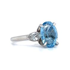 Santa Maria Aquamarine Diamond Ring in Platinum. Aquamarine stones are mined in locations all around the globe but some of the finest gem specimens are found in Brazil. In fact, it was in the Santa Maria de Itabira mine in Menas Gerais, Brazil, where the original aquamarine gemstone possessing a unique, deeply saturated blue hue was discovered. That is why aquamarine stones with such a color are now dubbed ‘Santa Maria,’ regardless of their origin. This beauty is flanked by glittering diamonds o Exquisite Oval Platinum Gemstones, Oval Platinum Gemstone With Center Stone, Oval Multi-stone Sapphire Ring In Platinum, Oval Topaz Ring In Platinum, Oval Sapphire Gemstone With Center Stone, Oval Sapphire Gemstone With Multi-stone Detail, Oval Multi-stone Sapphire Gemstones, Heirloom Diamond Gemstones With Accent Stones, Oval Sapphire Gemstones With Accent Stones