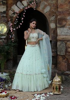 Featuring here mint green flared Lehenga Set with mirror, bead, zari work , paired with net dupatta mirror & work blouse Fabric - Silk, Georgette, net Components - 3 Colour - Mint Green Embroidery details - Hand Embroidery Delivery time - 2-3 weeks Washing Instructions - Dry-clean Party Wear Net Sharara With Mirror Work, Embellished Pista Green Choli For Diwali, Green Net Choli With Zari Work, Floor-length Net Sets With Dori Work, Party Wear Sets With Mirror Work On Net, Green Dori Work Lehenga For Party, Diwali Embellished Choli In Pista Green, Embellished Anarkali Sets In Pista Green, Festive Green Net Lehenga