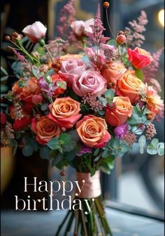 a vase filled with lots of flowers on top of a window sill next to a sign that says happy birthday