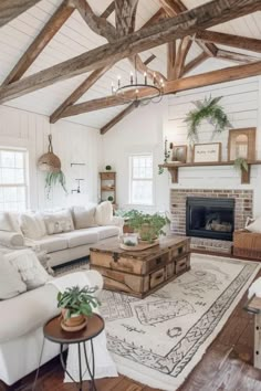 a living room filled with furniture and a fire place in the middle of a room