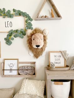 there is a stuffed lion head on the wall in this child's playroom