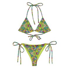 Unleash Your Imagination Dive into summer with the Whimsical Alien World String Bikini! This vibrant and playful design features a captivating array of extraterrestrial characters brought to life with bold greens, purples, yellows, and blues. Each unique creature adds a burst of personality and joy to the bikini, making it a fun and attractive choice for those who love to stand out. It's life but as we know it! Joyful and Eye-Catching Design The Whimsical Alien World pattern is a celebration of imagination and creativity. With its delightful mix of quirky alien forms and bright colors, this bikini captures the essence of summer fun. The rhythmic symmetry and playful interactions among the characters create a lively tapestry that's perfect for all-over prints, ensuring you look fabulous fro