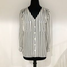 Nwot H&M Long Sleeve Button Down Striped Collarless Blouse | V-Neck | White With Thin Black Vertical Slimming Stripes | Mother Of Pearl Buttons With Beautiful Flash Of Rainbow | Roll Tab Sleeves - Use The Tab And Button To The Outside Of Sleeve For 3/4 Length Sleeves! | 2 Front Patch Pockets On Chest | Small Slits On Sides | Loose Fitting, Lightweight And Airy | Slightly Sheer | 100% Polyester | Size 2 | Length Across Chest Is 18.5” | Inseam Is 17” | Length From Shoulder To Bottom Hem Is 25.5” Rainbow Roll, Mother Of Pearl Buttons, Pearl Buttons, Striped Blouse, Mother Of Pearl, Length Sleeve, Button Down Shirt, H&m, Flash