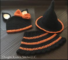 a crocheted hat and booties with an orange bow on the side, sitting next to each other