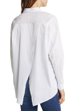 Modern polish defines this oversized stretch-poplin shirt crafted with hidden pockets. Spread collar Long sleeves 60% polyester, 30% cotton, 10% spandex Hand wash, dry flat Made in the USA Spring Relaxed Fit Poplin Shirt, Oversized Poplin Tops For Spring, Relaxed Fit Poplin Top For Work, Spring Poplin Tops With Relaxed Fit, White Oversized Poplin Shirt, Oversized White Poplin Shirt, Modern Oversized Blouse For Daywear, Relaxed Fit Poplin Button-up Top, Relaxed Fit Long Sleeve Poplin Blouse