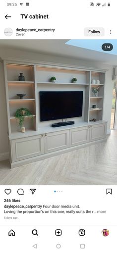 an entertainment center with built - in shelving and led lighting on the bottom shelf