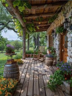 a porch with chairs and flowers on it