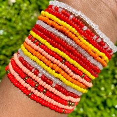 You will receive 10 assorted mixed fire color STRETCH STYLE seed bead bracelets. Bracelets will be chosen randomly and may/may not include the pictured selection.  This listing contains bracelets that STRETCH. Red Beaded Bracelets With Letter Beads For Summer, Summer Red Beaded Bracelets With Letter Beads, Red Beaded Friendship Bracelets For Summer, Red Round Beads Bracelets For Summer, Red Colorful Beaded Bracelets For Everyday, Fire And Ice, Seed Bead Bracelets, Grab Bags, Bag Set