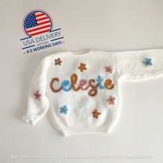 🌟 A Timeless Treasure: Hand-Embroidered Personalized Baby Sweater 🌟 Introducing our hand-embroidered personalized baby sweater, a timeless treasure that will warm your heart as much as it warms your little one. Made of the softest yarn and delicately personalized with your child's name, this sweater is more than just clothing--it's a symbol of love and a keepsake to be cherished for life. 🧶 Craftsmanship at Its Finest: Each sweater is meticulously hand-embroidered by our skilled artisans with Cream Letter Print Sweater For Winter, Cream Winter Sweater With Letter Print, Winter Cream Sweater With Letter Print, White Letter Embroidery Sweater For Winter, White Embroidered Logo Sweater For Fall, White Knitted Cotton Sweatshirt, White Letter Embroidery Sweater For Fall, Playful White Winter Sweater, Cute Letter Print Winter Sweater