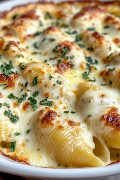 A delicious dish of Jumbo Stuffed Shells inspired by Olive Garden. Featuring creamy ricotta and drenched in rich marinara sauce, this is the perfect comfort food. Ideal for family gatherings! Stuffed Shells Recipe White Sauce, Stuffed Shells Olive Garden, Copycat Olive Garden Stuffed Shells, Cajun Shrimp Stuffed Shells, Stuff Shells Recipes Ricotta, Stuffed Shells Alfredo Sauce, Stuffed Shells With Seafood, Conchiglioni Pasta Recipes, Stuffed Shell Pasta Recipes