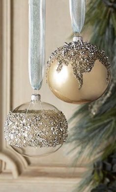 two ornaments hanging from a christmas tree