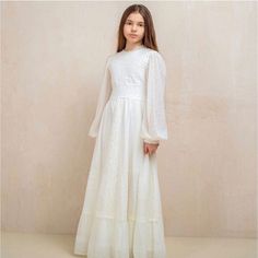 Lace First Communion Dress A Fabulously Wonderful Holy Communion Dress Will Definitely Create An Incredibly Festive Look For The First Communion Day In A Girl's Life. The Communion Dress Looks Very Soft And Beautiful Thanks To Two Layers Of Italian Lace. The Dress Is Fully Lined With 100% Pure And Soft Organic Cotton, Which Will Provide Comfort And Convenience When Wearing It. Long Sleeve Communion Dress. Made In Spain Us Size 7 Height 122cm/48in Chest 63cm/24.8in Waist 57cm/22.5in Hips 66cm/26i Blessing Dress, Holy Communion Dresses, Baptism Outfit, Lace Booties, First Communion Dress, Festive Look, Communion Dresses, First Holy Communion, Holy Communion