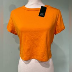 A Set Of 2 Women’s Crop Top By Wild Fable Size Xl Orange You Will Receive 2 Shirts Basic Orange Tops For Summer, Casual Orange Short Sleeve Crop Top, Cheap Orange Sleeveless Crop Top, Orange Short Sleeve Casual Crop Top, Trendy Orange Short Sleeve Crop Top, Cheap Orange Crop Top, Orange Short Sleeve Crop Top, Wild Fable Crop Top, Affordable Orange Sporty T-shirt