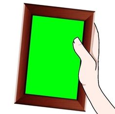 a hand holding a green screen in front of a wooden frame on a white background