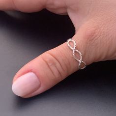 Introducing our Silver Infinity Minimalist Adjustable Ring - a symbol of timeless elegance. This versatile layer band is a chic addition to any ensemble, perfect as a thumb ring or for stacking with your favorites.  Whether it's a birthday or Christmas, this ring makes for a thoughtful gift that she'll cherish.  Embrace style and simplicity - shop now to surprise her with a touch of infinity. 🧡 Crafted with attention to detail, this ring exudes elegance and versatility. Its double layer design adds a touch of sophistication to any outfit. Elevate your summer jewelry collection with this exquisite piece that combines style and comfort. Don't miss the opportunity to own this must-have accessory. Order now and make a fashion statement that reflects your individuality! ----------------------- Woman Birthday, Thumb Rings Silver, Thumb Ring, Classy Jewelry, Layer Design, Lovely Ring, Thumb Rings, Birthday Gift For Her, Stackable Ring